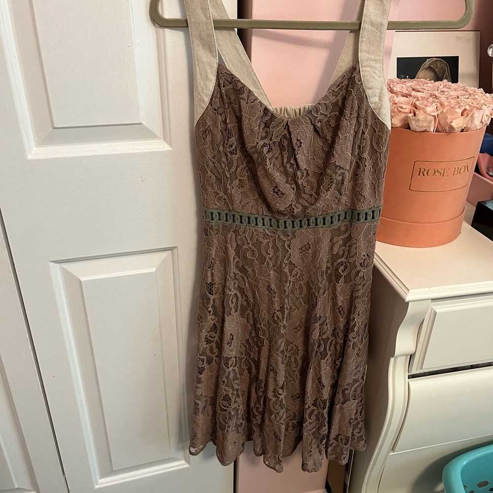 Lace fit-and-flare mini dress with crème straps and back tie detailing